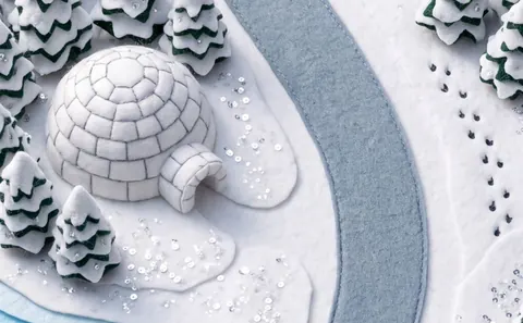 Frost: an igloo of white felt beside a frozen lake.