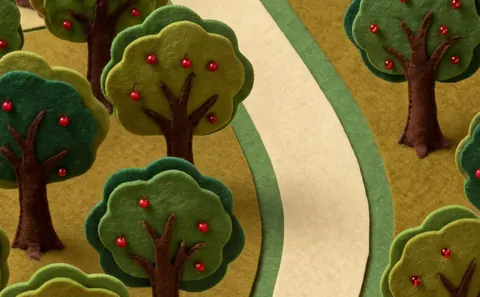 Harvest: an orchard of felt apple trees along a path.